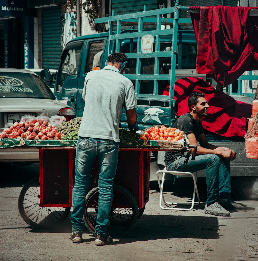 Busy street market with vendors and pedestrians in a Chilean city