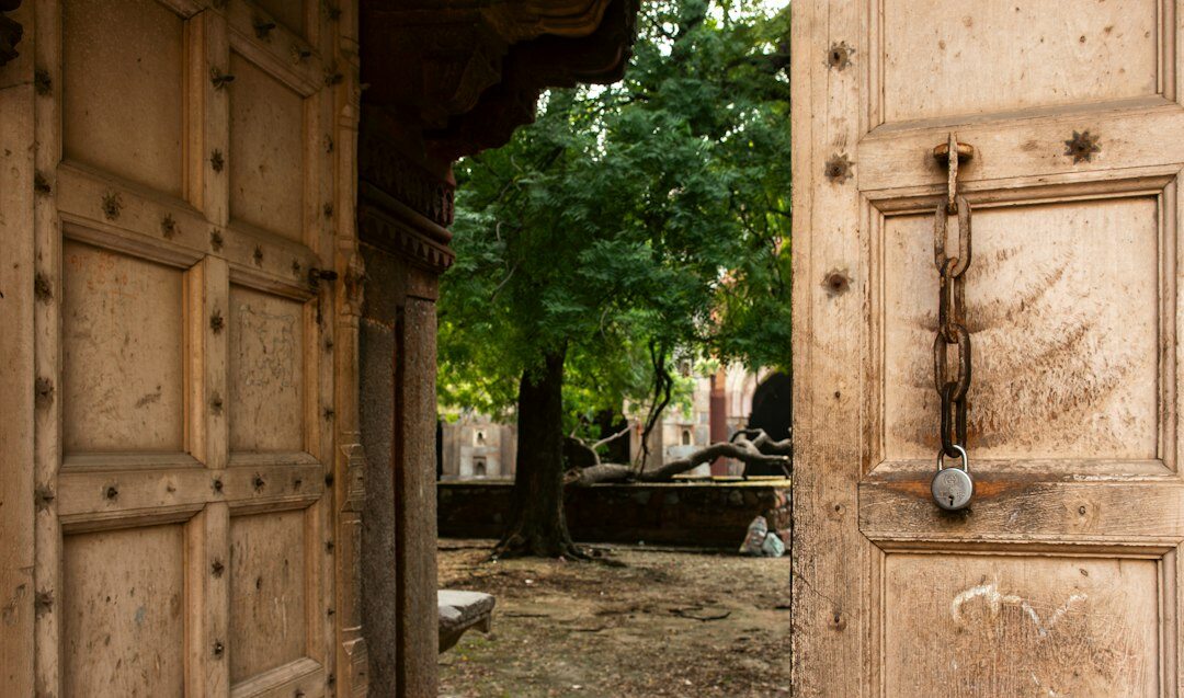 person opening old door