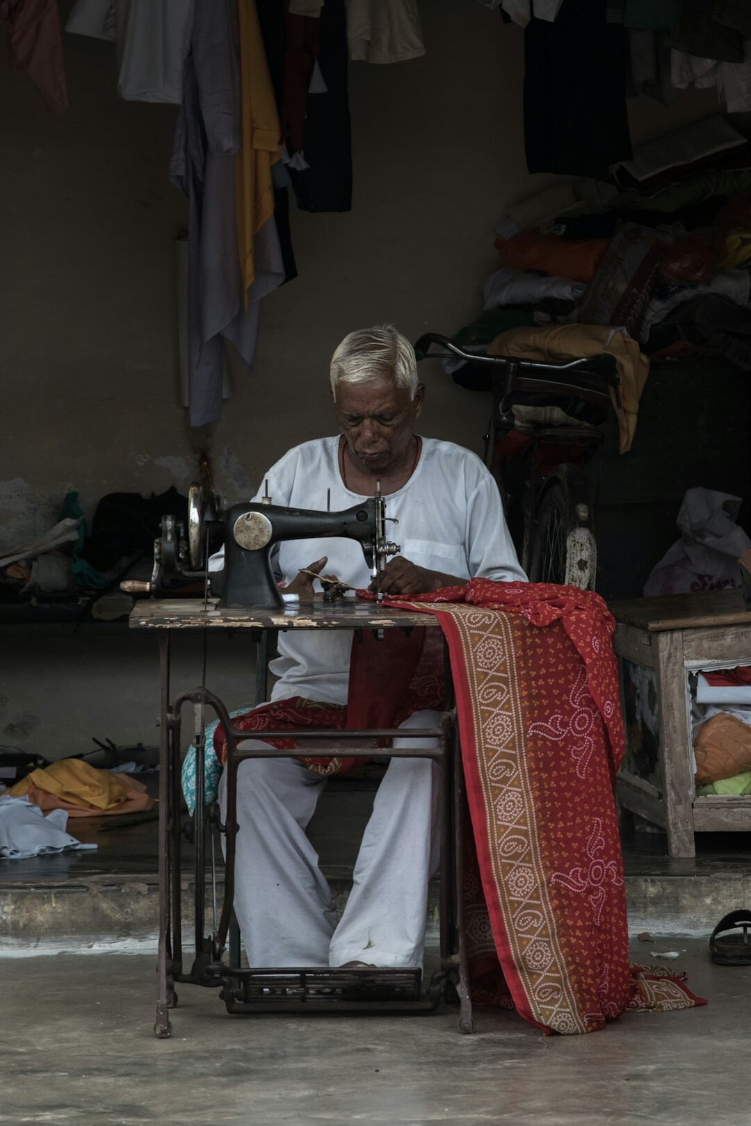 elderly woman sewing